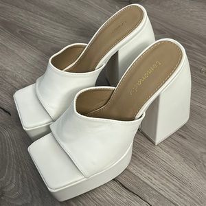 Retro disco white platform women’s wedge heels. Never worn! Fit size 6-7.5